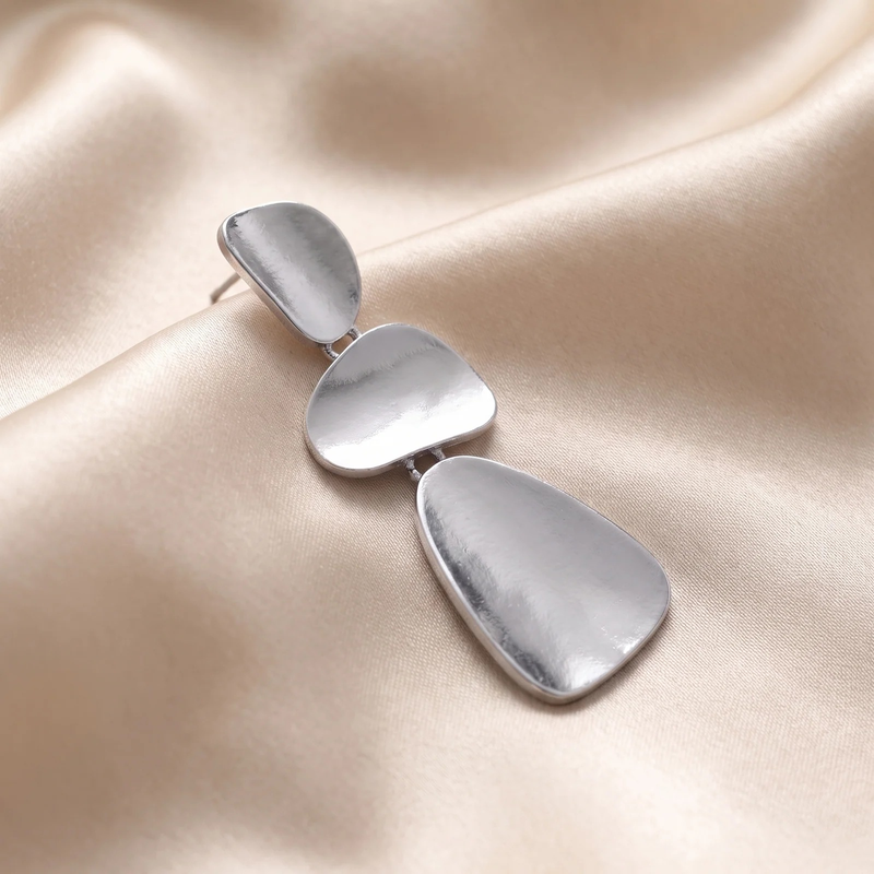Close-up of silver Organic Pebble Tier Drop Earring finish