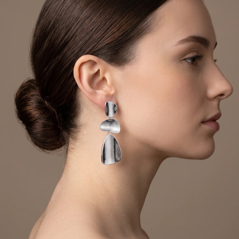 Side profile showing how the Organic Pebble Tier Drop Earring hangs