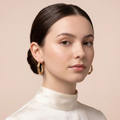 Model wearing Gold Twisted Rope Hoop Earrings