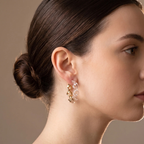Side profile on ear: Silver and Twisted Resin Hoop Earrings