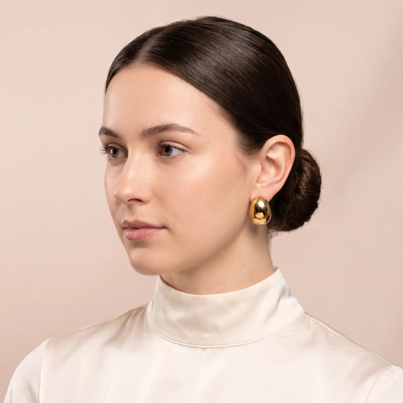 Model wearing Gold Sculptural Puff Stud Earrings
