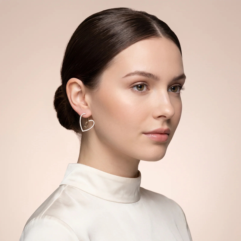 Model wearing Open Heart Loop Hoop Earrings