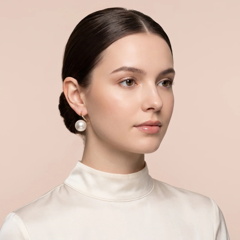 Model wearing Classic Pearl Drop Earrings