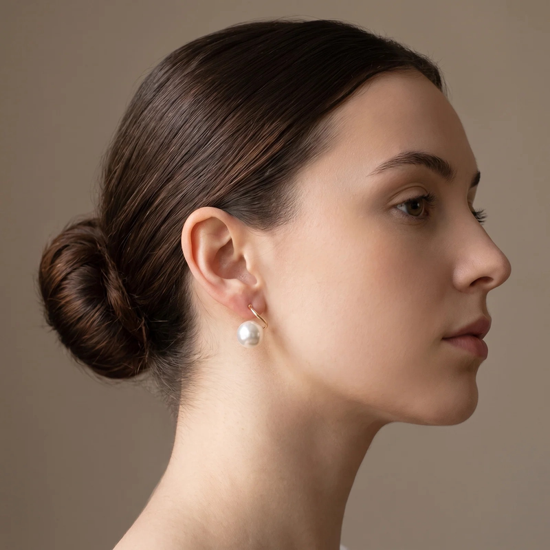Side profile on ear: Classic Pearl Drop Earrings