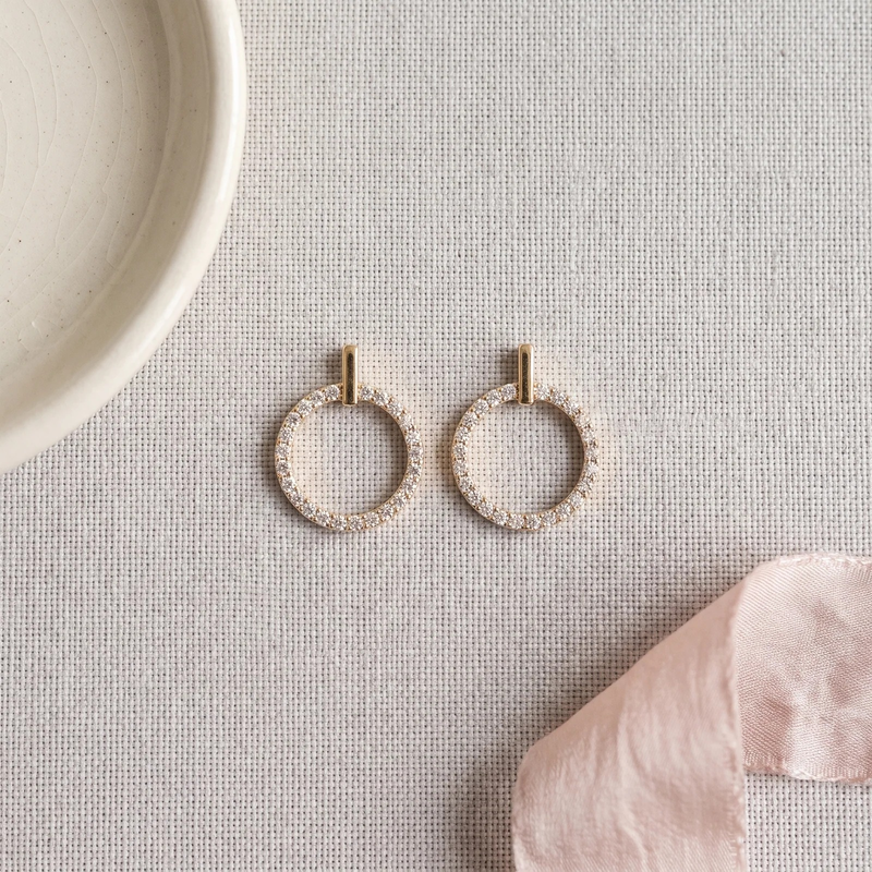 Flat lay of Halo Circle Bar Studs
