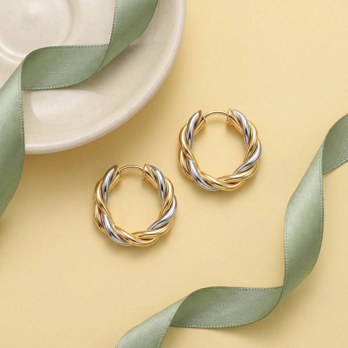 Flat lay of Two-Tone Twisted Rope Hoop Earrings