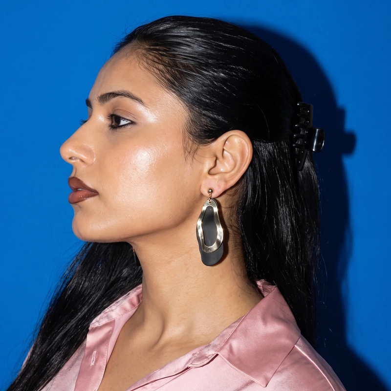 Side profile on ear: Sculptural Undulating Open Hoop Earrings