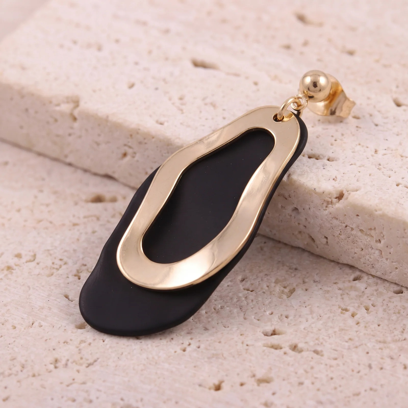 Close-up detail of Sculptural Undulating Open Hoop Earrings