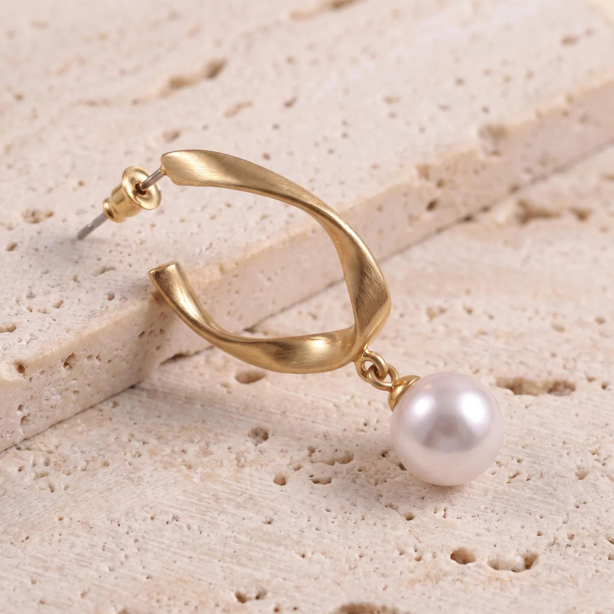 Close-up detail of Twisted Gold Hoop Pearl Drop Earrings