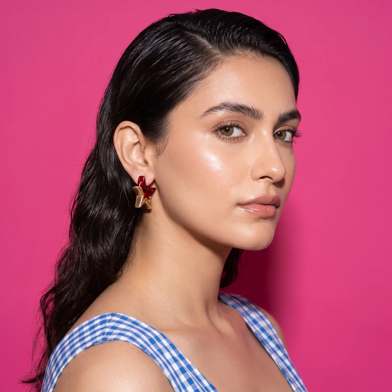 Side profile on ear: Ruby Élan Star Earrings