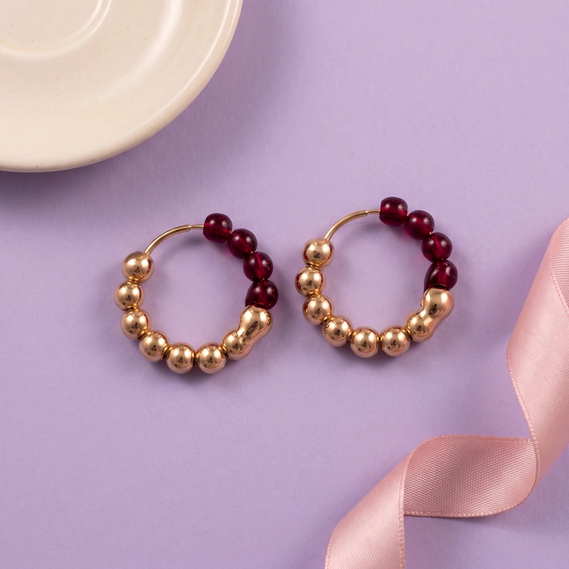Flat lay of Ruby Luxe Beaded Hoops