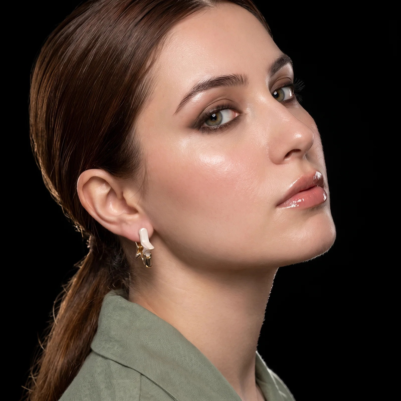 Side profile on ear: Ivory Star Sculptural Earrings