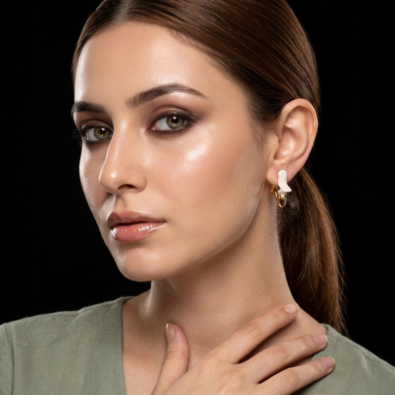 Model wearing Ivory Star Sculptural Earrings