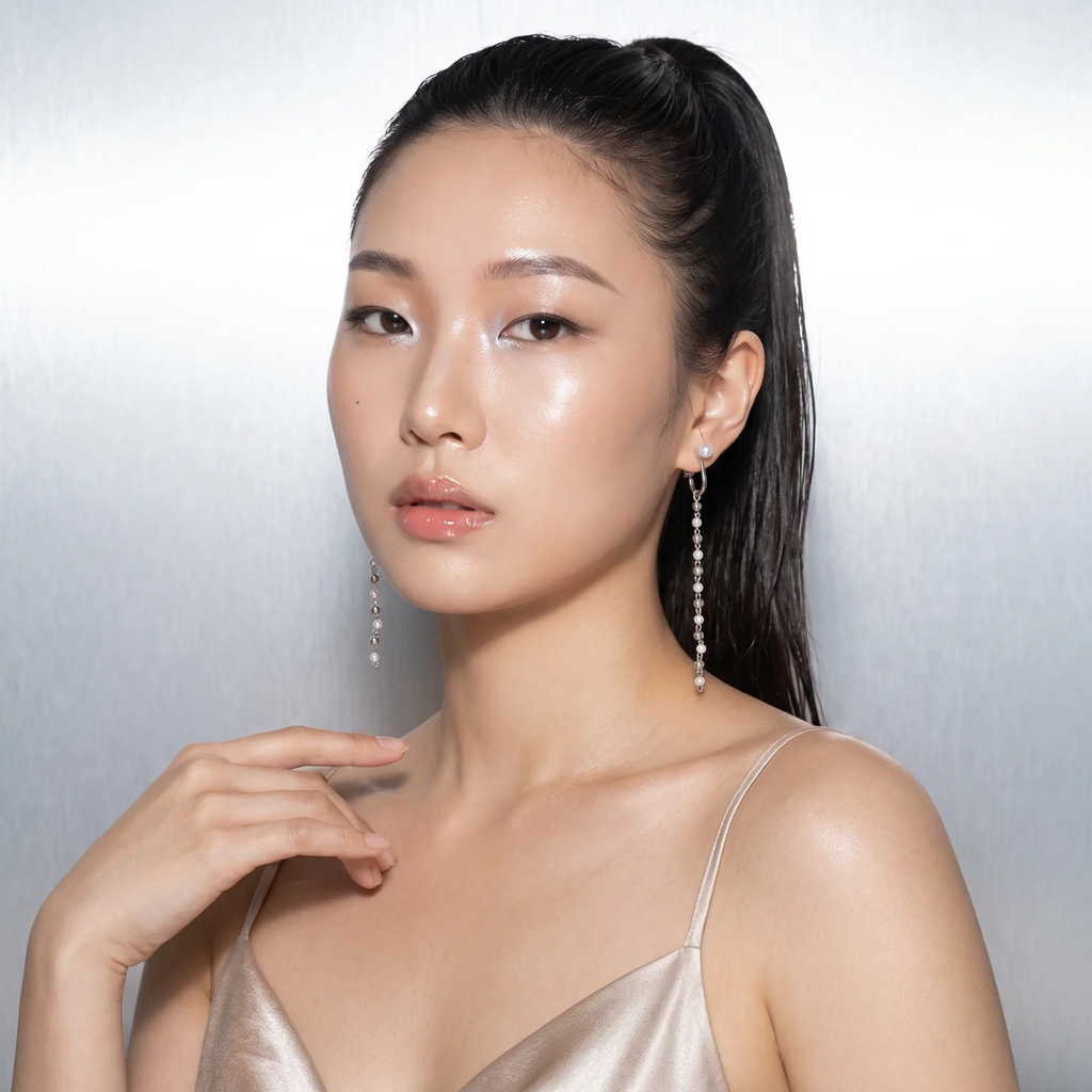 Model wearing Cascade Pearl Drop Earrings