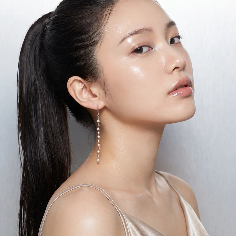 Side profile on ear: Cascade Pearl Drop Earrings