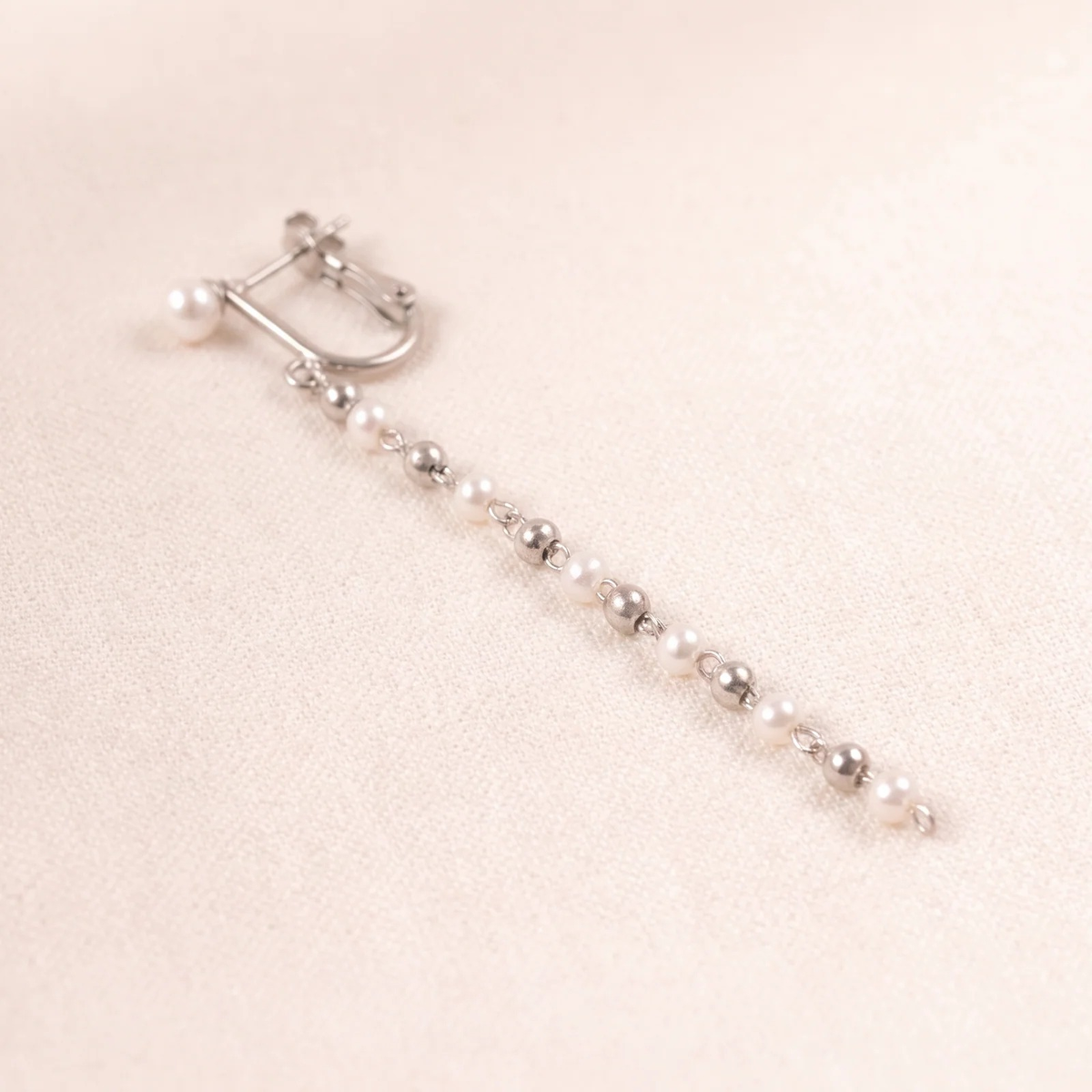 Close-up detail of Cascade Pearl Drop Earrings