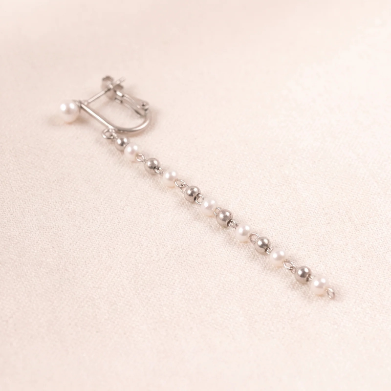 Close-up detail of Cascade Pearl Drop Earrings