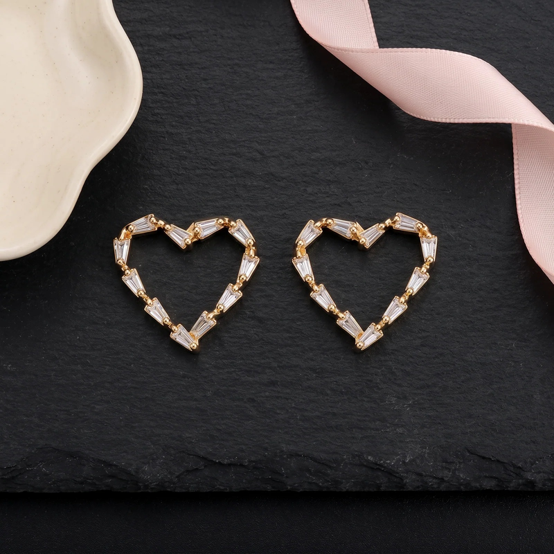Flat lay of Gold Baguette Heart Earrings
