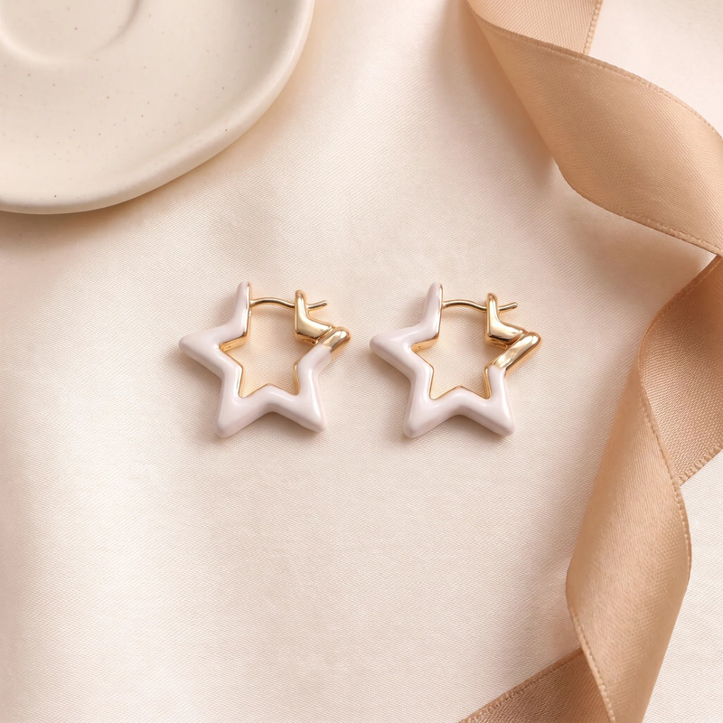 Flat lay of Ivory Star Sculptural Earrings