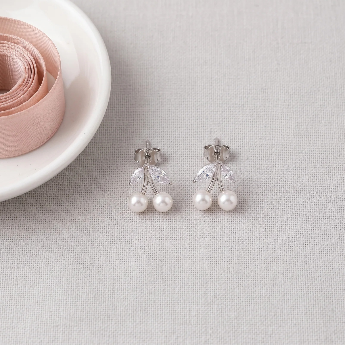 Flat lay of Cherry Pearl Studs