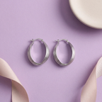 Flat lay of Luna Ribbed Hoop Earrings