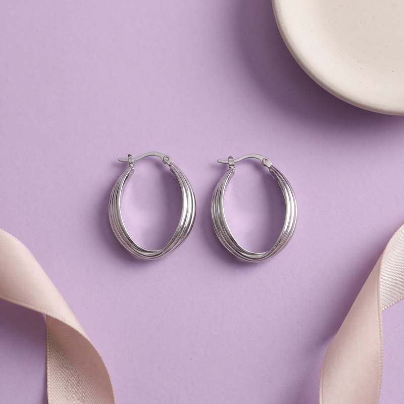 Flat lay of Luna Ribbed Hoop Earrings
