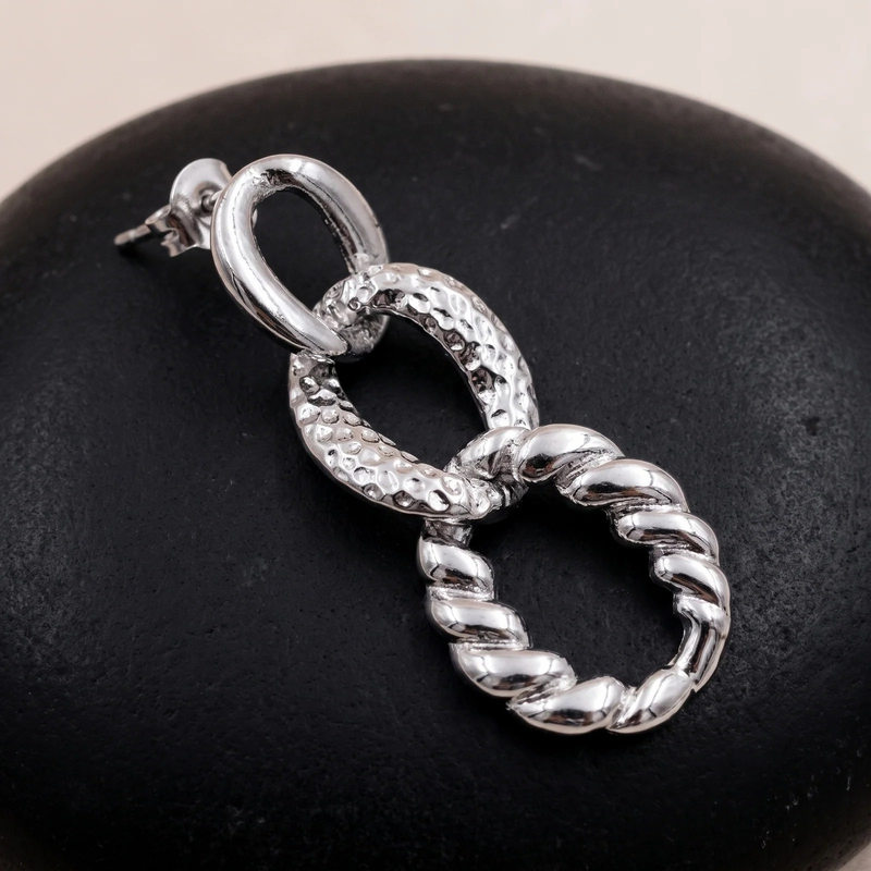 Close-up detail of Mixed Texture Link Drop Earrings