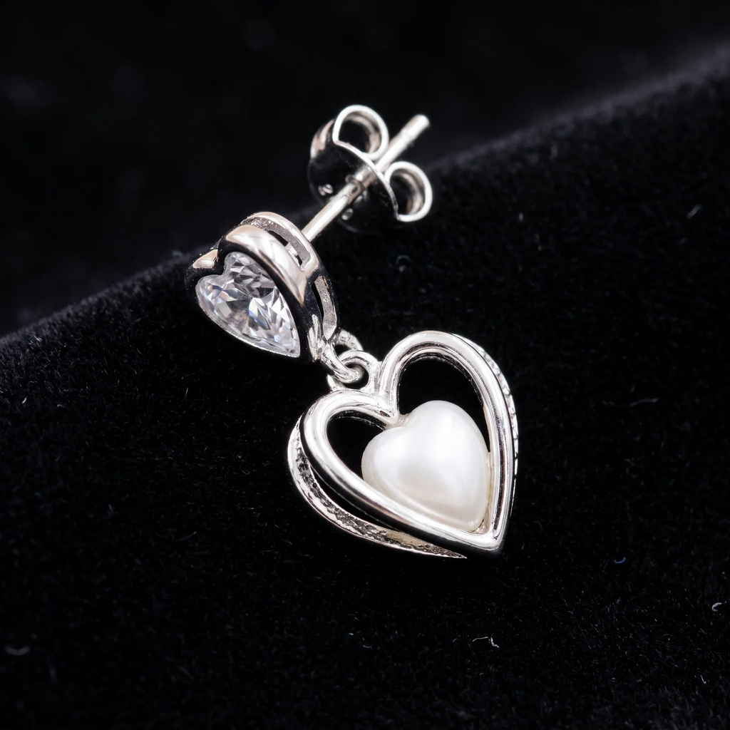 Close-up detail of Double Heart Crystal Drop Earrings