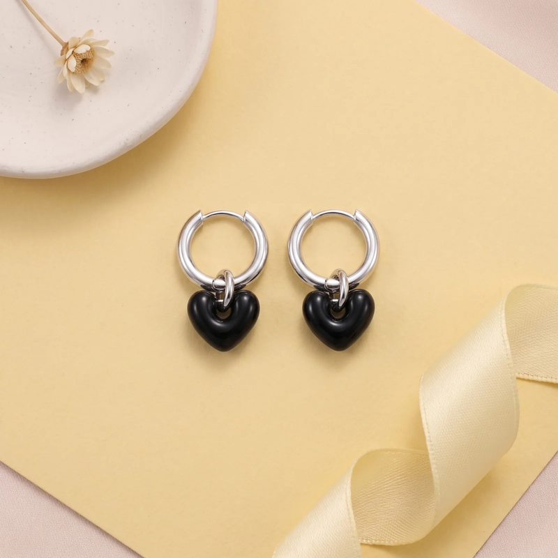 Flat lay of Heart Charm Hoop Earrings