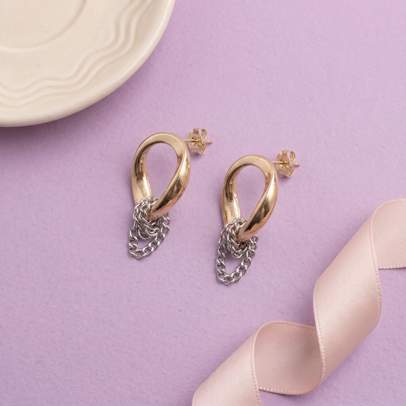Flat lay of Teardrop Loop Chain Tangle Earrings