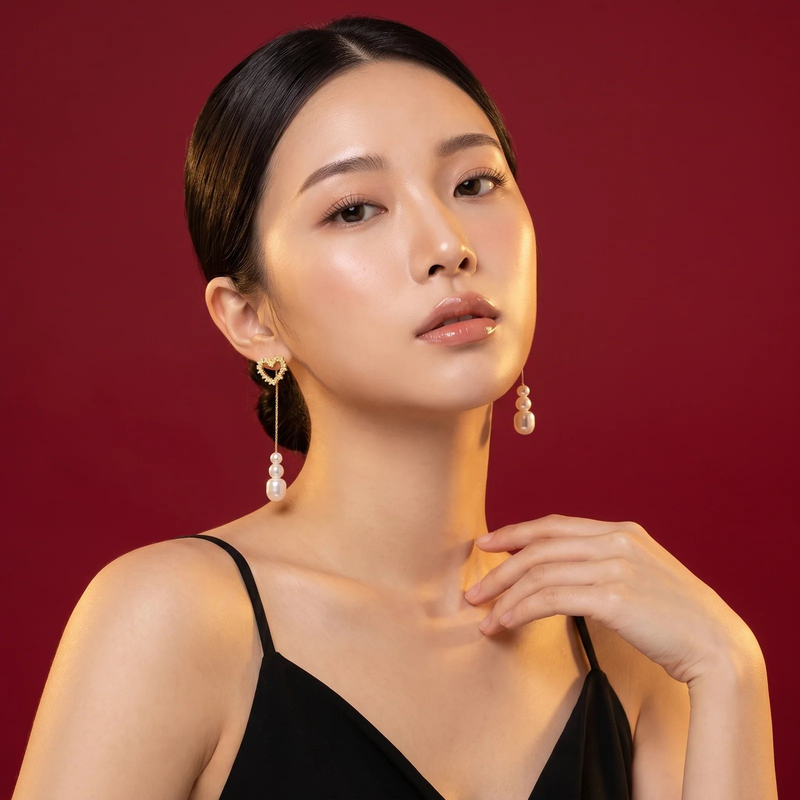 Model wearing Crystal Heart Pearl Drop Earring