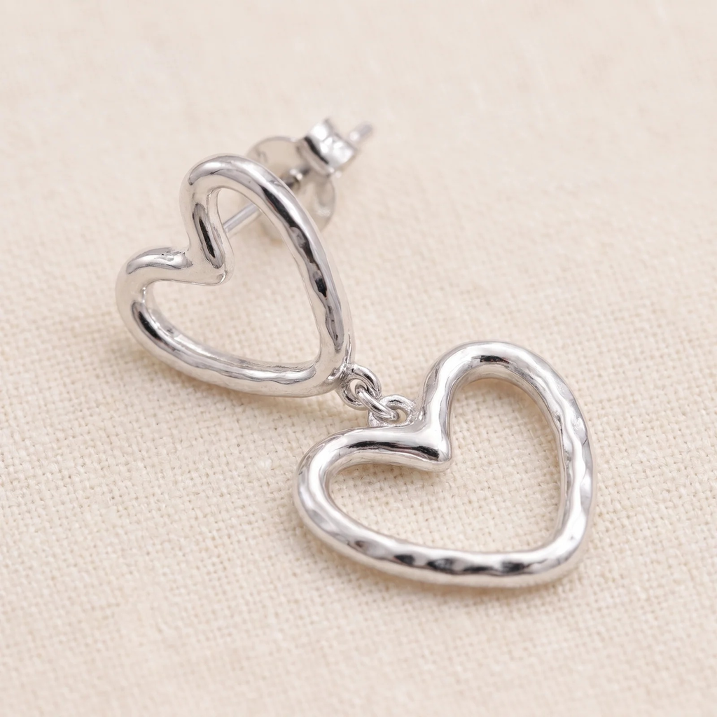 Close-up detail of Double Heart Outline Drop Earrings