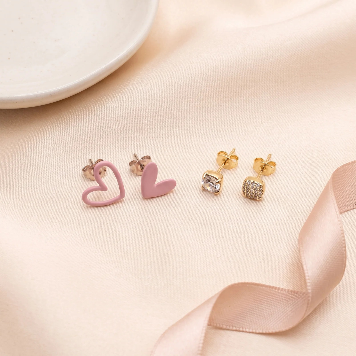 Flat lay of Playful Heart & Pavé Stud Duo