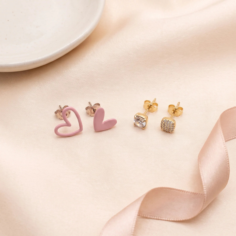Flat lay of Playful Heart & Pavé Stud Duo