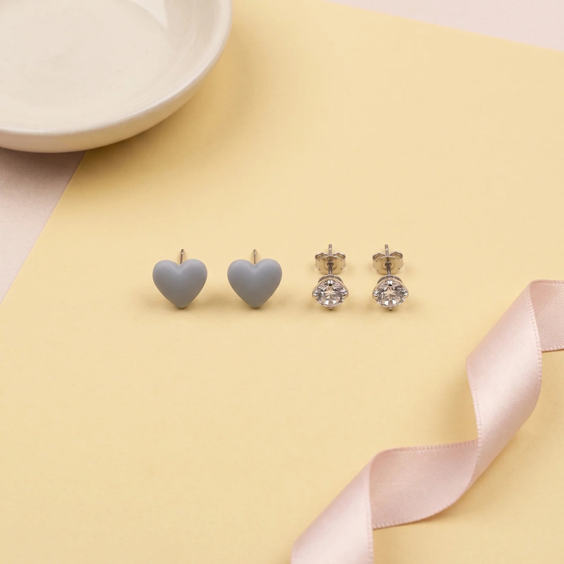 Flat lay of Heart & Crystal Mismatched Stud Set