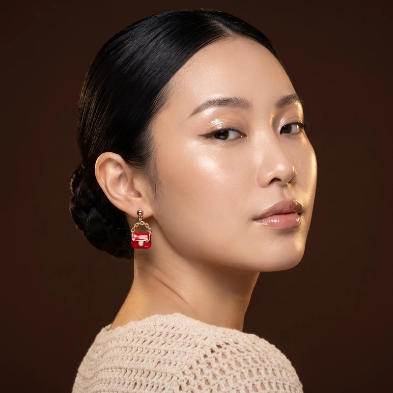 Model wearing Mini Handbag Charm Earrings