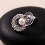Close-up detail of Crystal Crescent with Pearl Stud Earrings