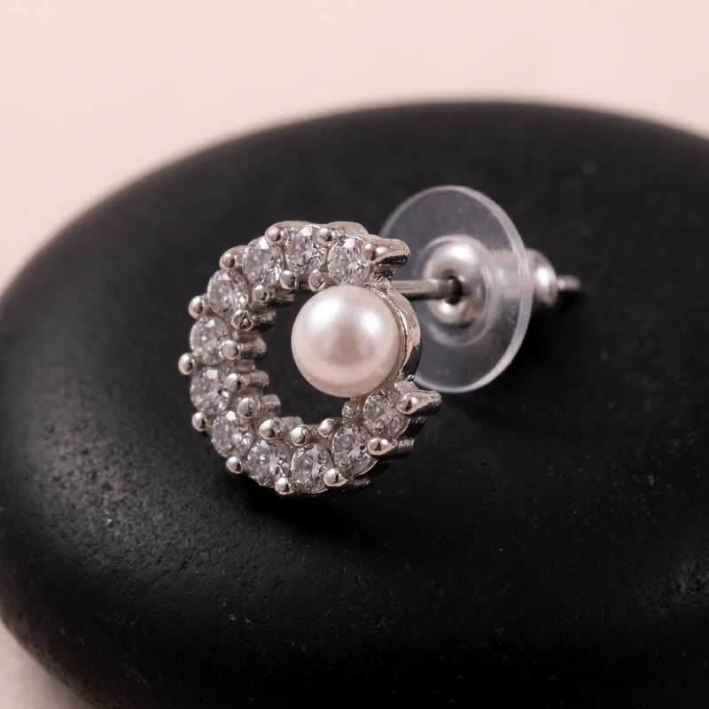 Close-up detail of Crystal Crescent with Pearl Stud Earrings