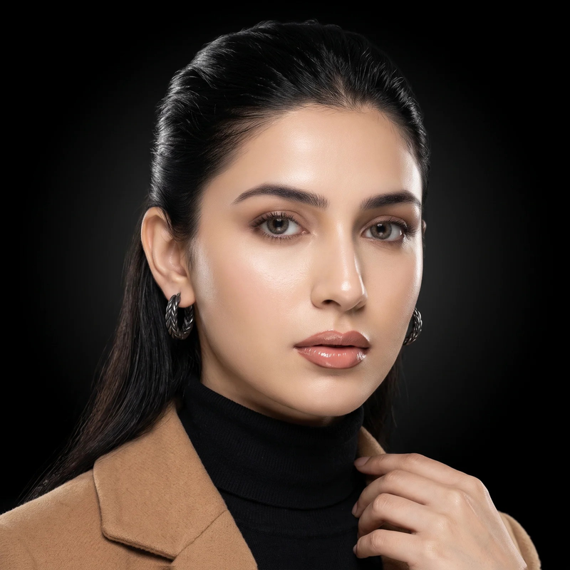Model wearing Zephyr Braid Hoop Earrings