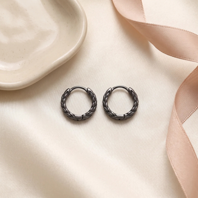 Flat lay of Zephyr Braid Hoop Earrings