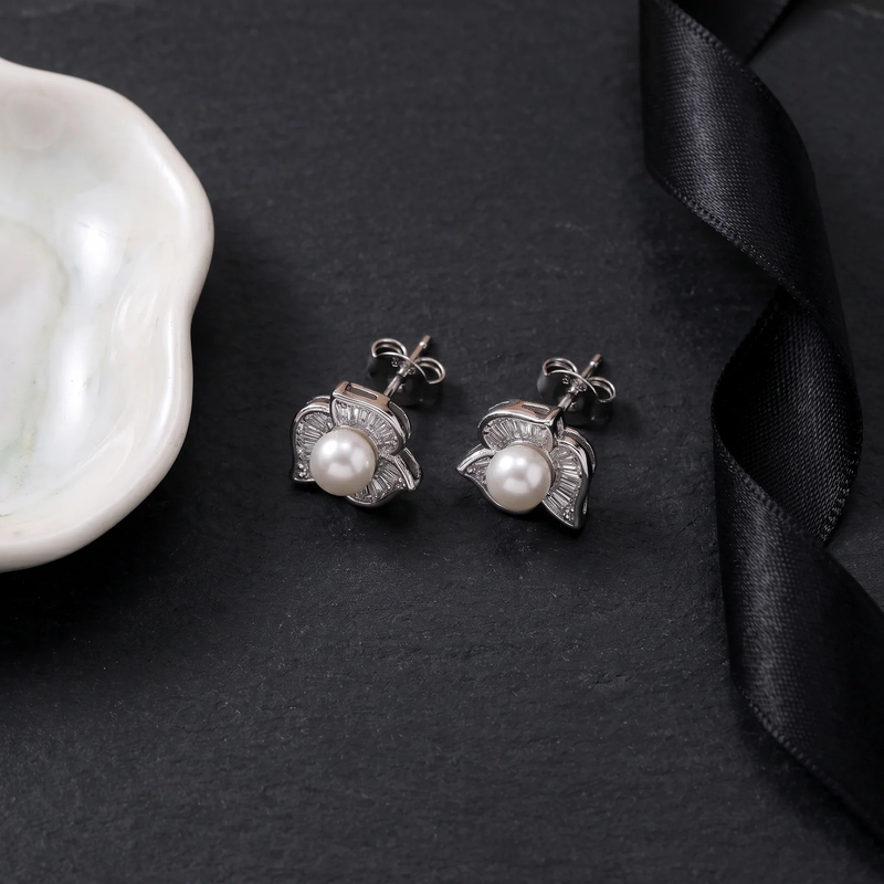 Flat lay of Pearl & Crystal Flower Stud Earrings