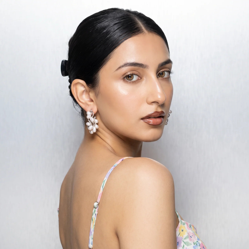 Model wearing Pearl Cluster Wave Hoop Earrings