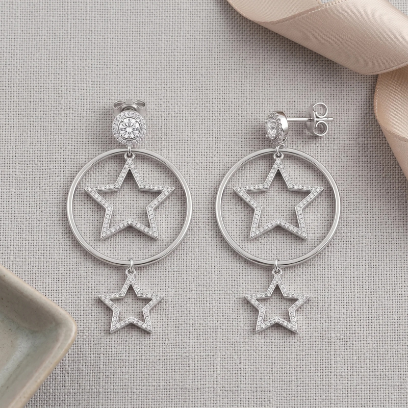 Flat lay of Silver Celestial Star Hoop Drop Earring