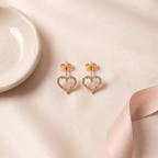Flat lay of Gold Heart Crystal Stud Earrings
