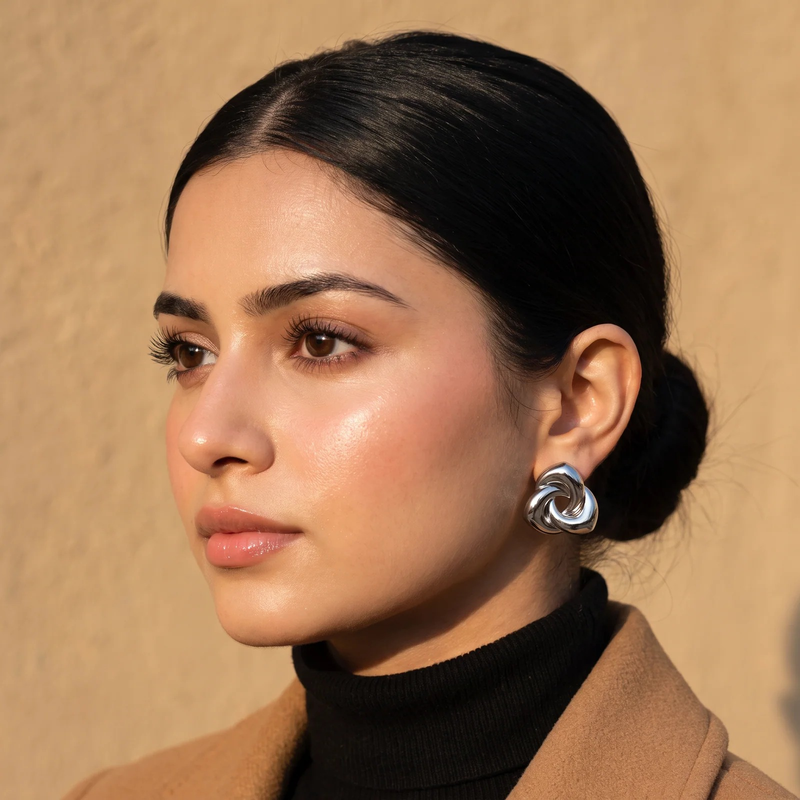 Side profile on ear: Chunky Twisted Knot Stud Earrings