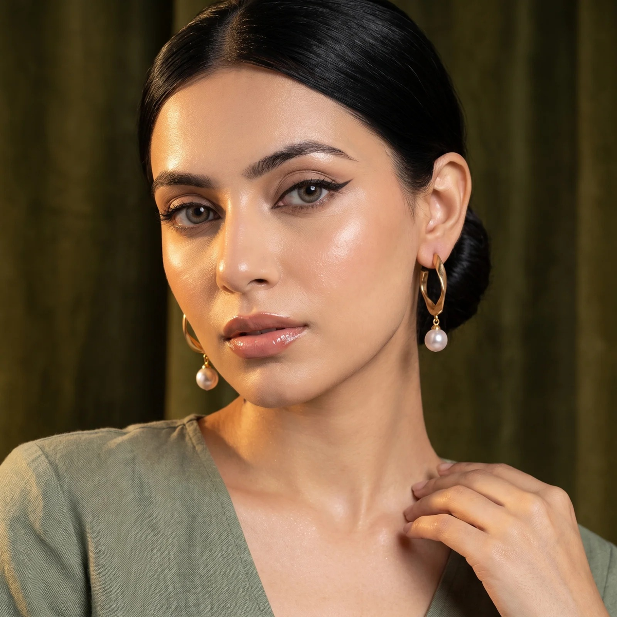 Model wearing Twisted Gold Hoop Pearl Drop Earrings