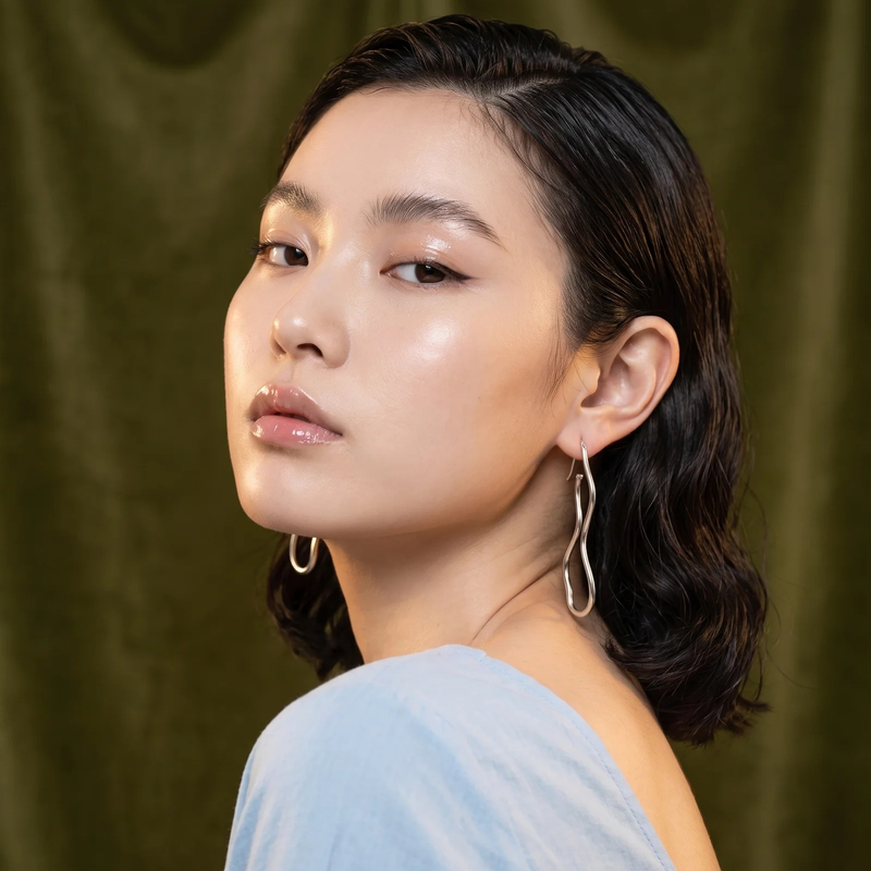 Model wearing Resin & Gold Organic Layered Drop Earrings