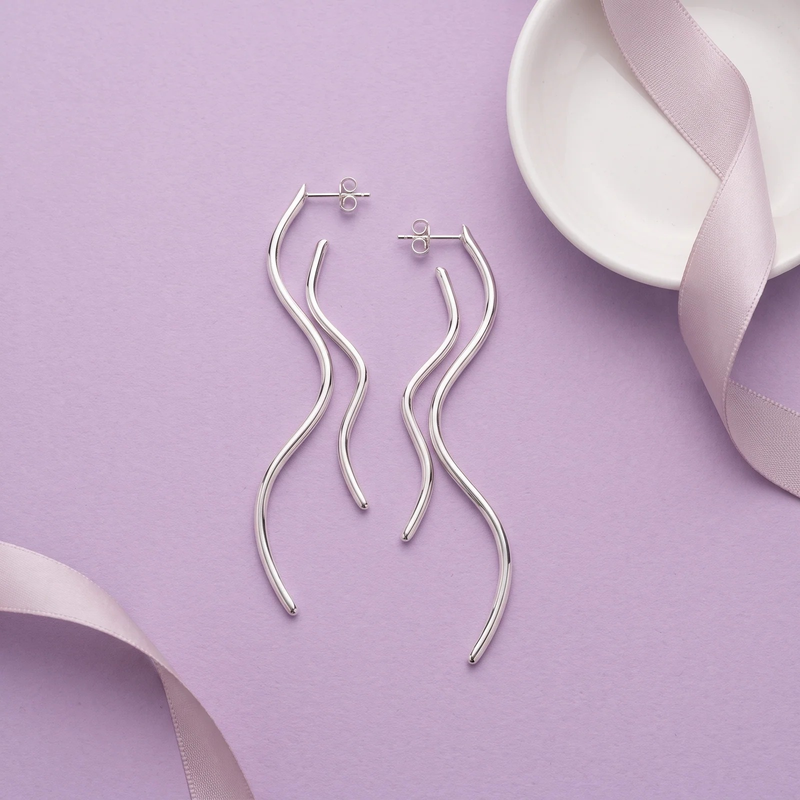 Flat lay of Resin & Gold Organic Layered Drop Earrings