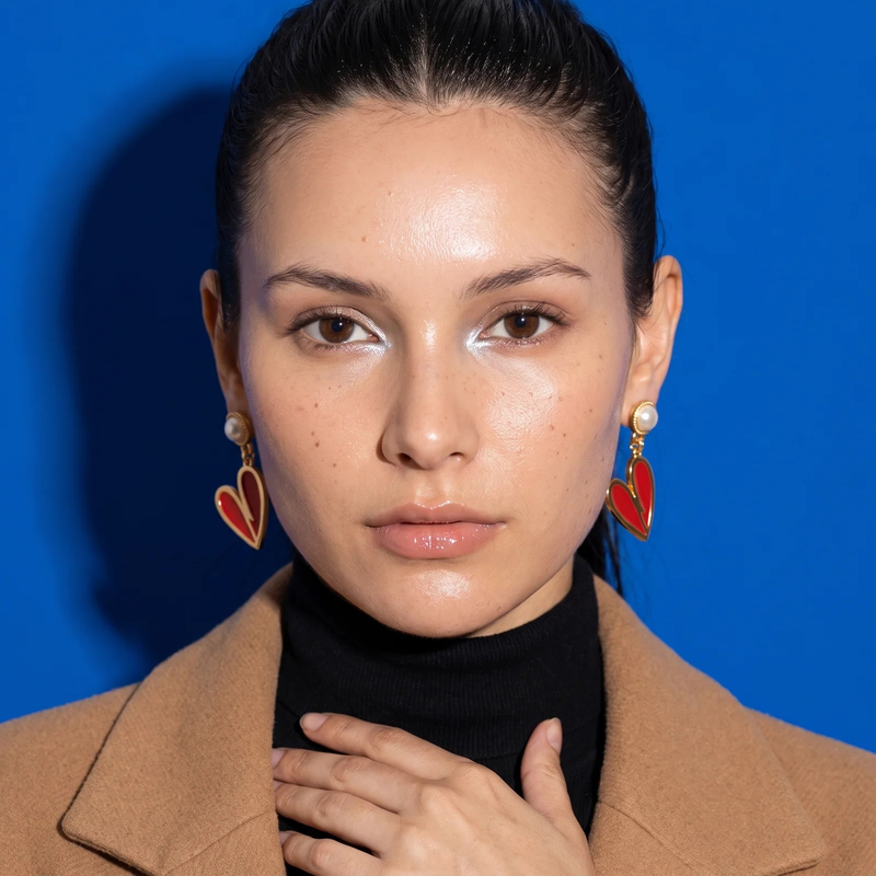 Model wearing Gold Heart Earrings