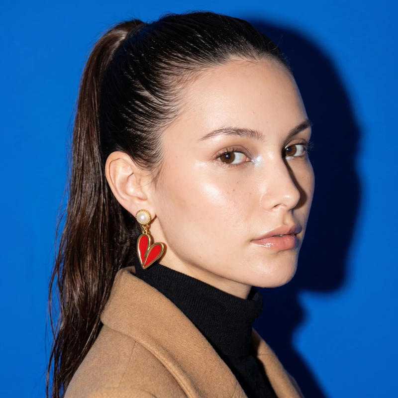 Side profile on ear: Gold Heart Earrings